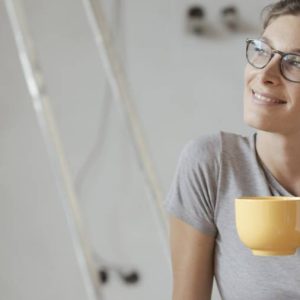 Person relaxing after installing photoelectric smoke alarms