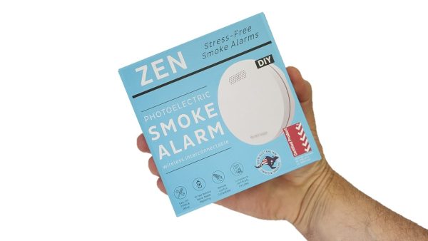 ZEN photoelectric smoke alarms (1-pack box) being held by hand