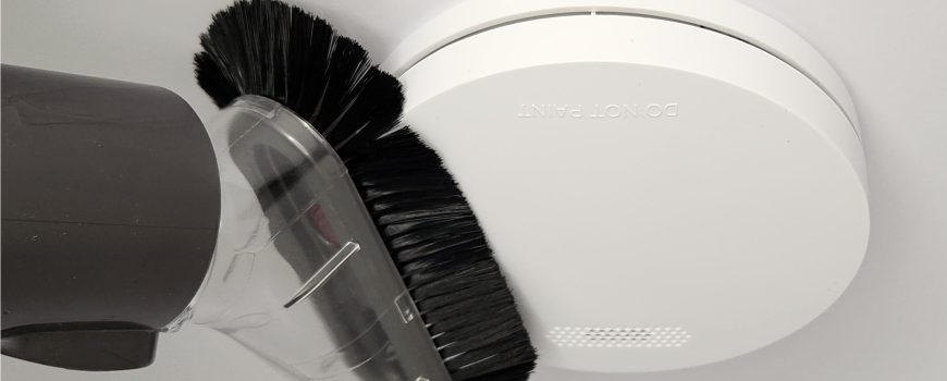 ZEN photoelectric smoke alarm cleaning with soft brush attachment from a vacuum
