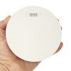 ZEN photoelectric smoke alarm being held by a hand (front view)