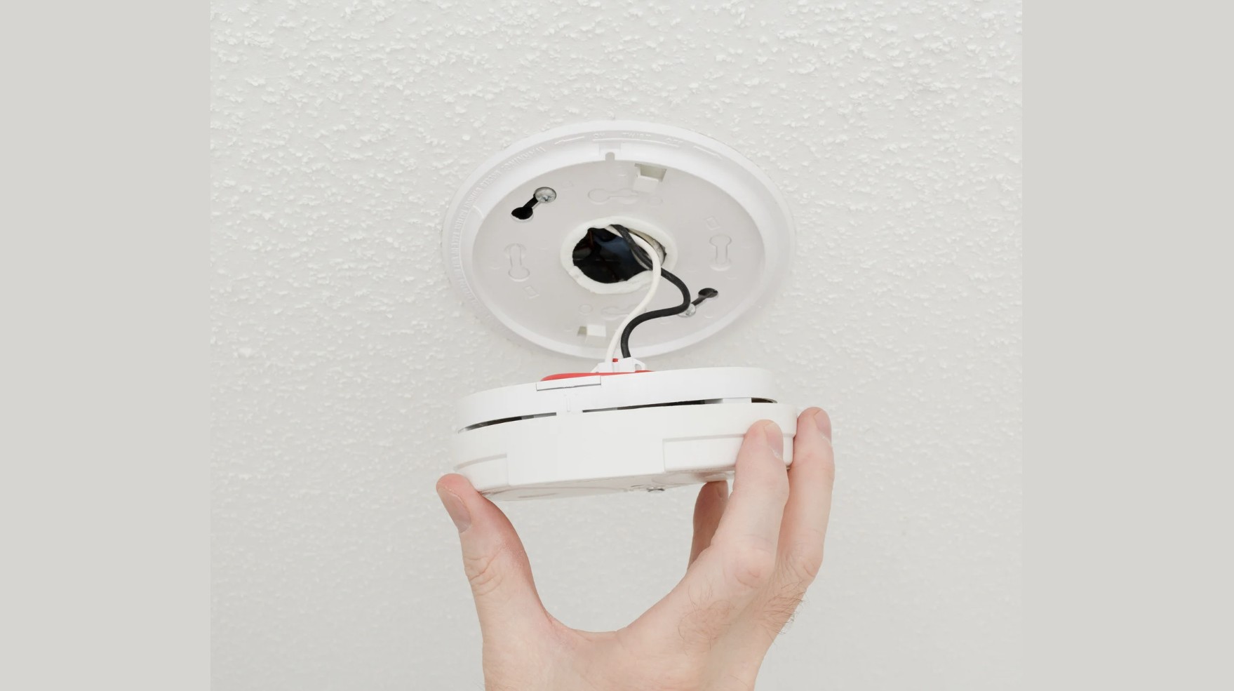 hard wired fire alarm vs wireless battery alarms