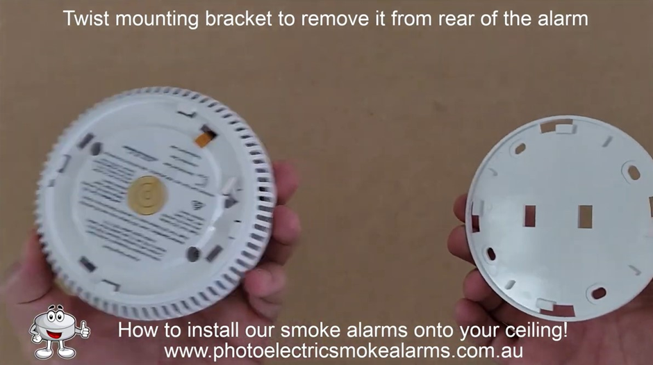 Twist the mounting bracket to remove it from the smoke detector