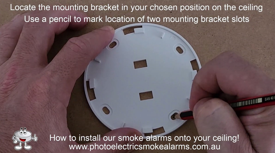 Use a pencil to mark location of the smoke detector's mounting bracket slots on the ceiling