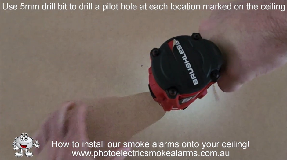 Use a 5mm drill bit to drill two pilot holes into the ceiling for the smoke detector bracket