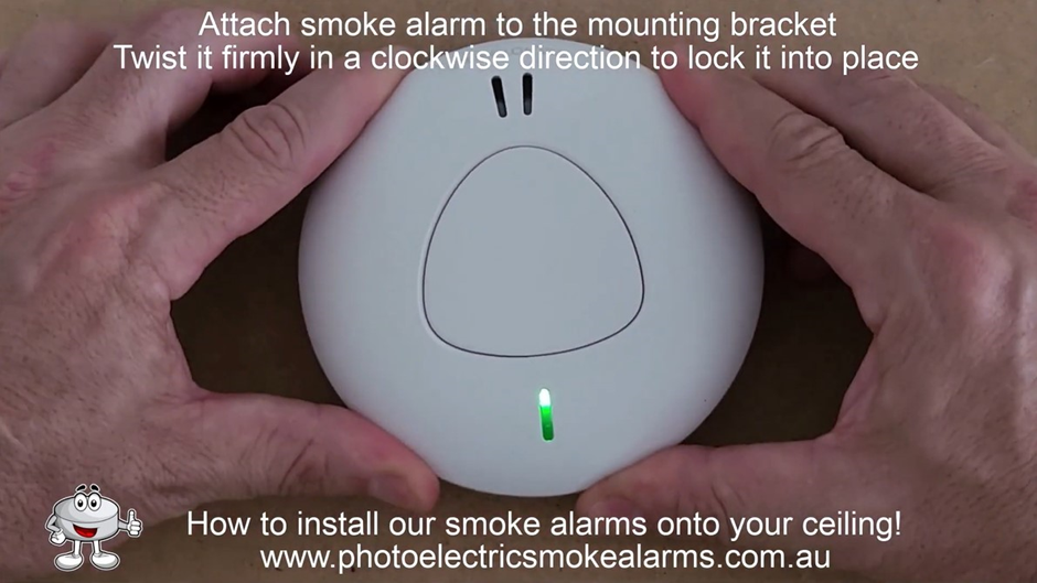 Turn clockwise to lock the smoke detector onto the mounting bracket on the ceiling