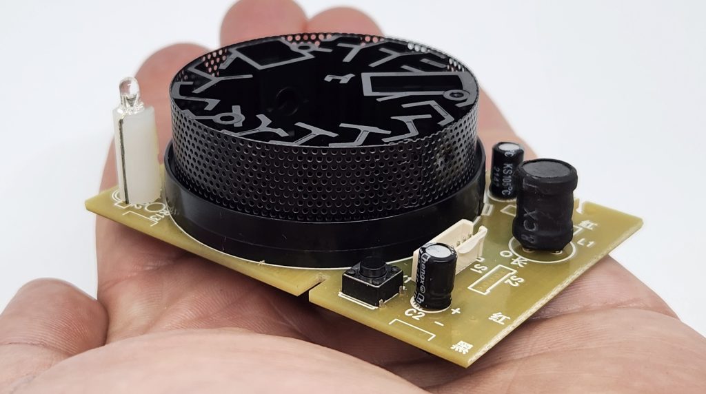 smoke sensor alarm in hand